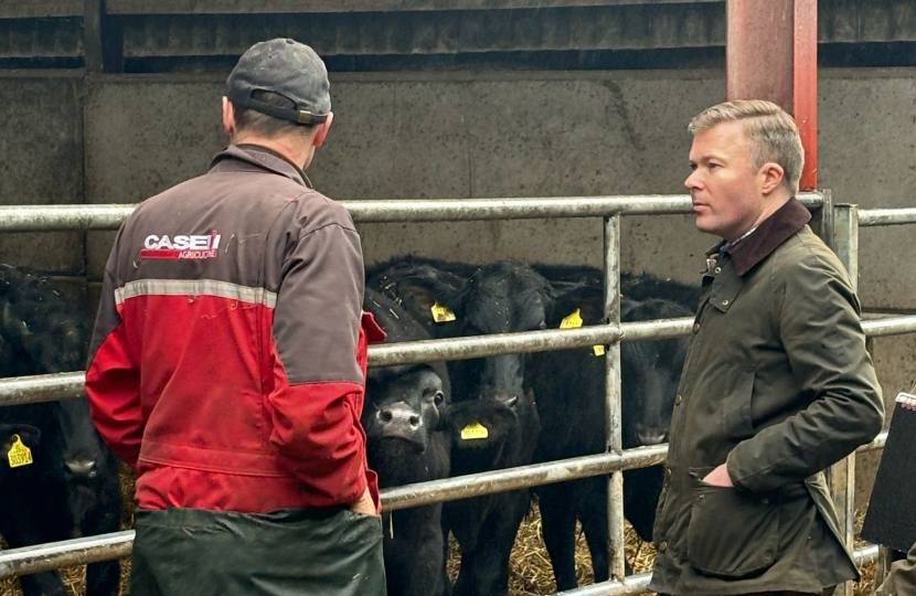 Bradley discussing the importance of farming with a local farmer