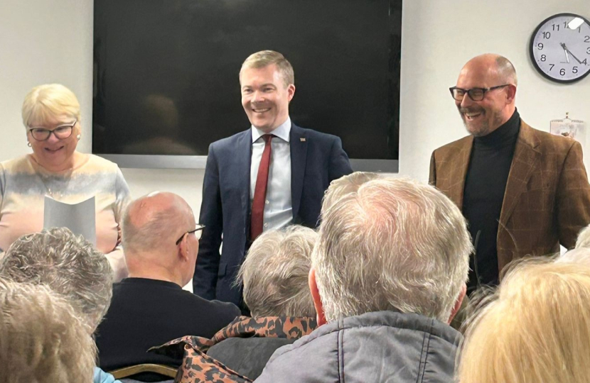 Bradley and Cllr Adam Kent with local residents