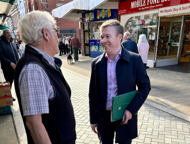 Bradley with a local resident on Bromsgrove High Street