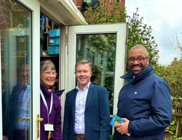 Bradley with Home Secretary, James Cleverly MP, meeting residents