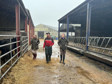 Bradley walking with a local farmer and NFU representative Emma Hamer